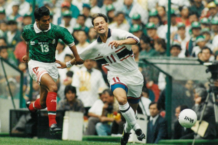 Eric Wynalda fighting a ball during a World Cup match against Mexico