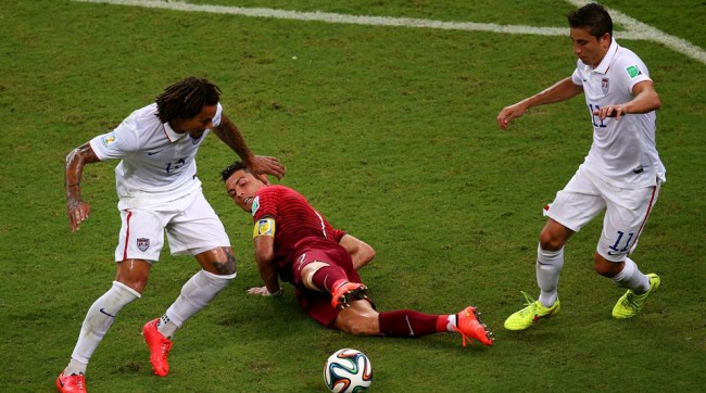Jermaine Jones (USA) winning a ball from Cristiano Ronaldo (Portugal) during the 2014 FIFA World Cup